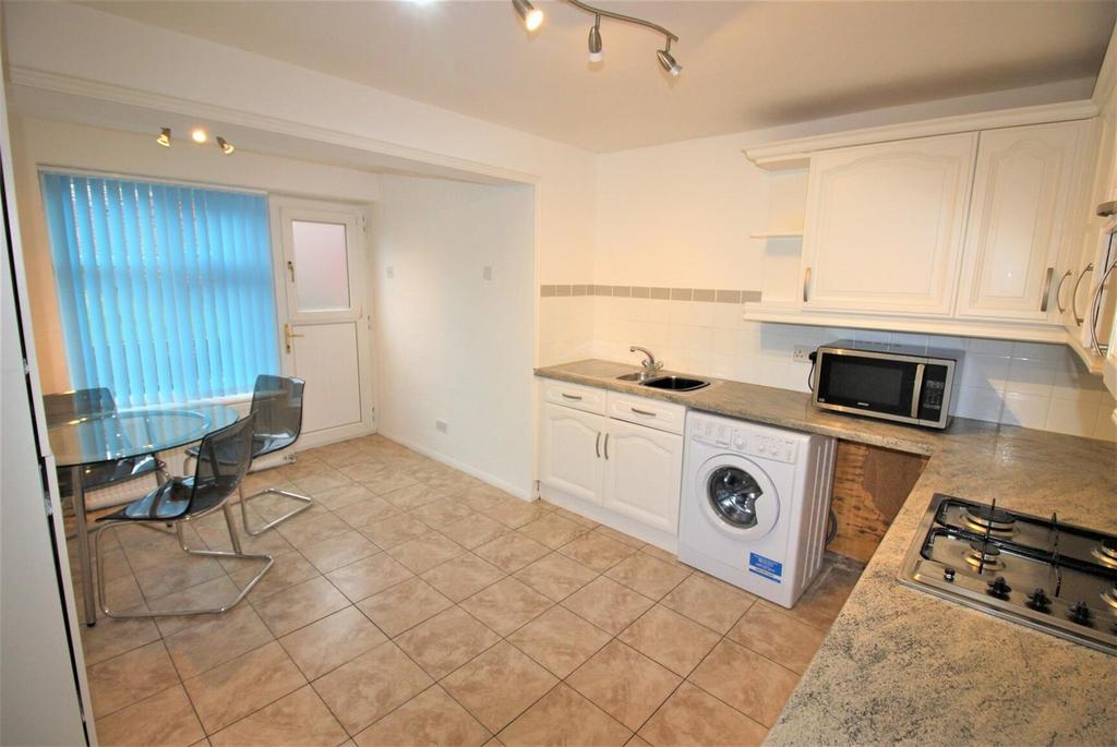 Bright fitted kitchen with dining area...
