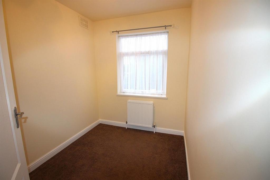 Neat single bedroom with window and radiator...