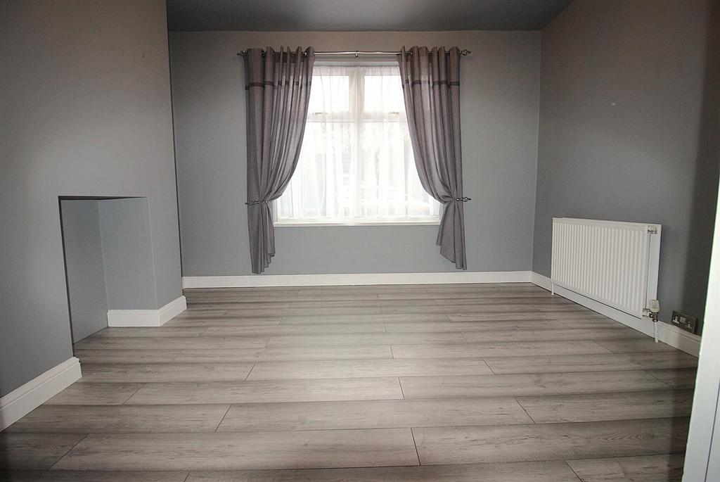 Bright room with large window and modern floori...