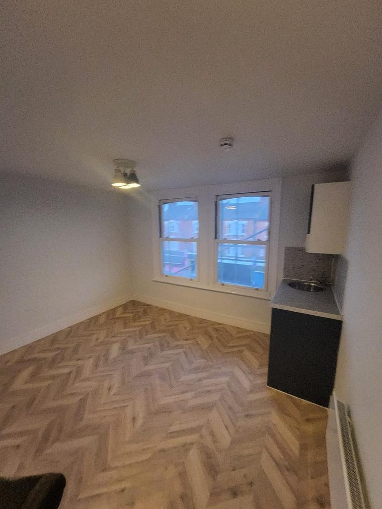 Bright room with new herringbone flooring...