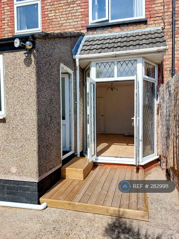 French Doors Down To Decking And Garden