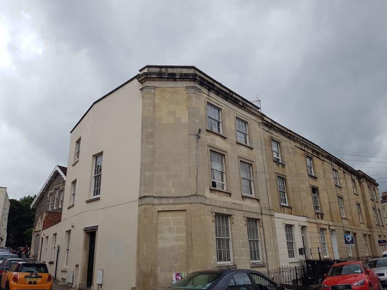 Historic terraced building with on-street parki...