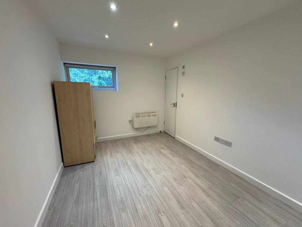 Bright, neutral single room with new flooring...