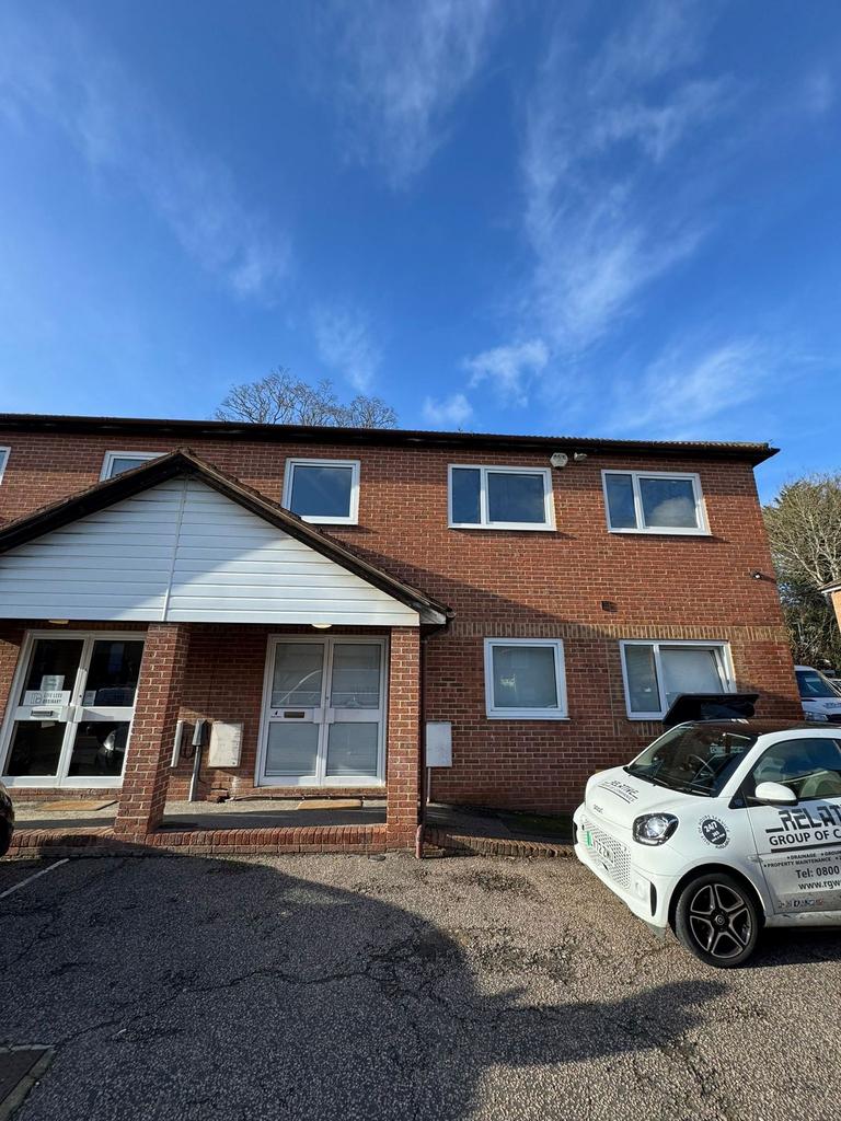 Brick-front property with parking and bright sk...