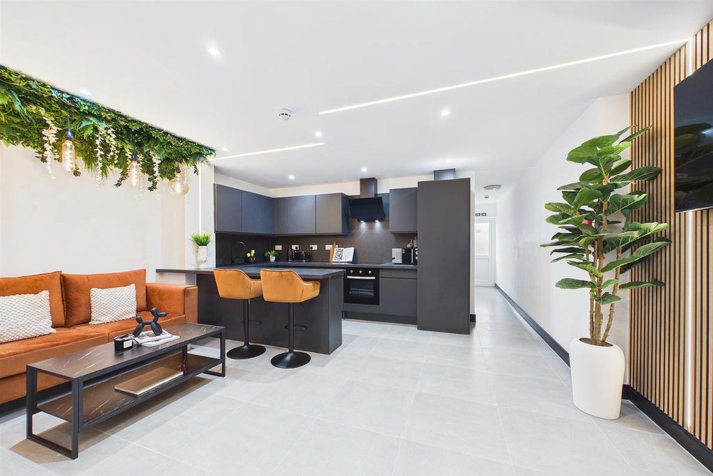 Modern open-plan living area with kitchen...