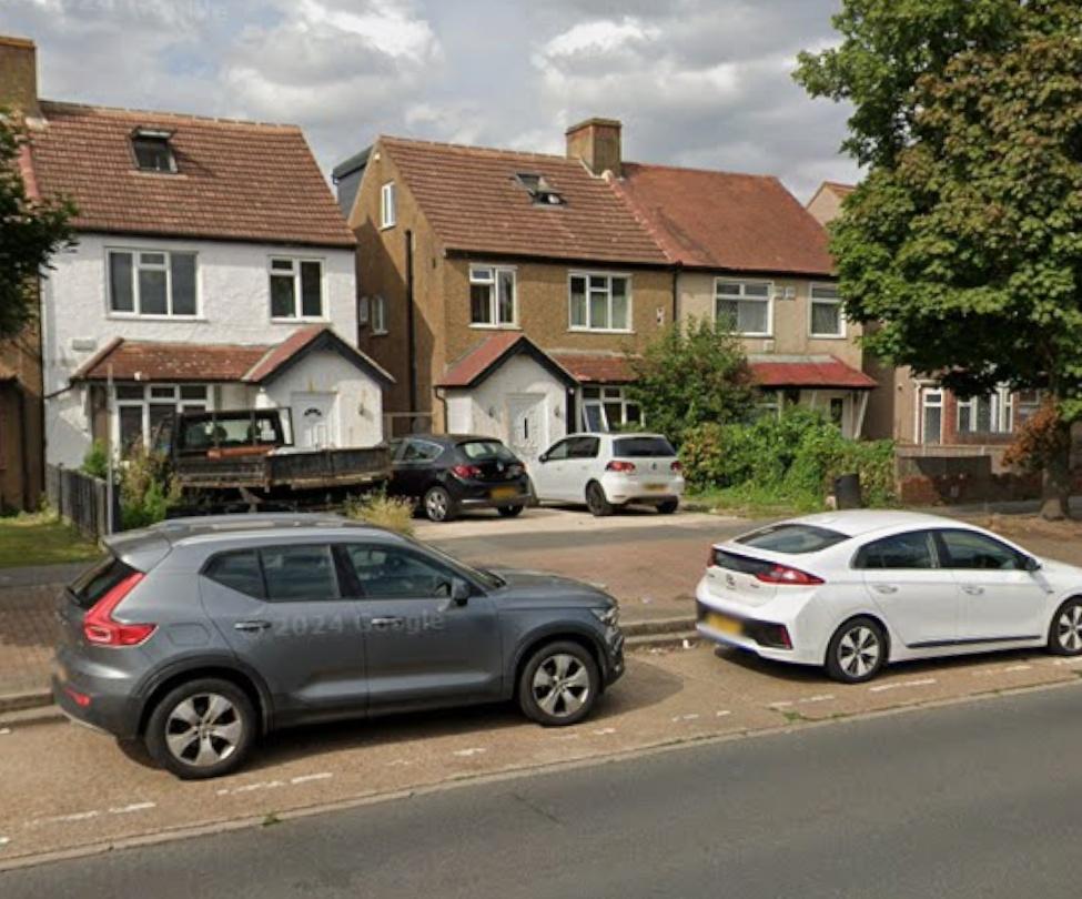 Terraced homes with driveway parking and street...