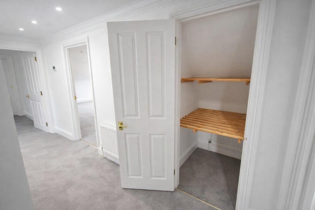 Hallway with wooden shelves