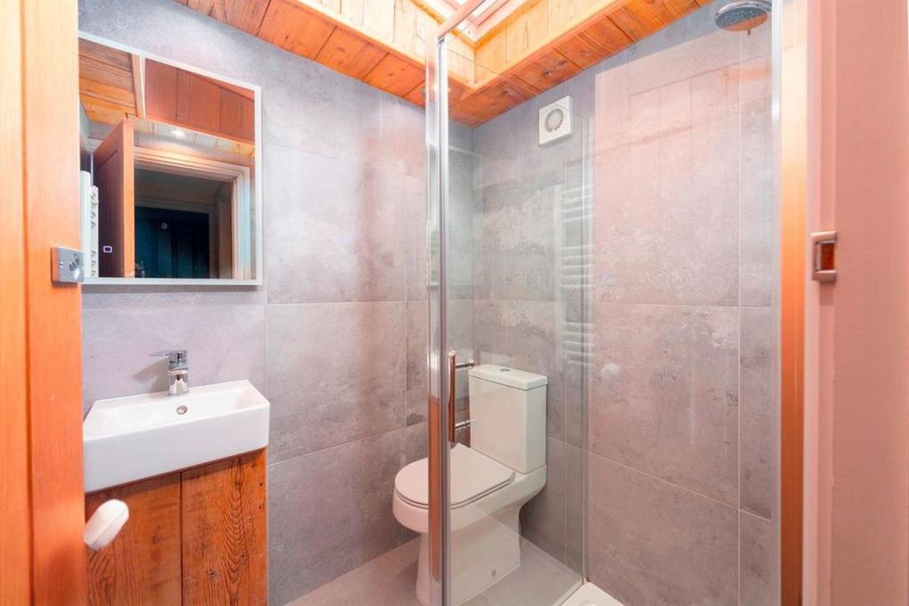 Modern ensuite bathroom with walk-in shower...