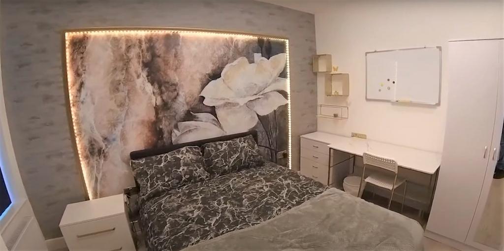 Stylish double bedroom with built-in study area...