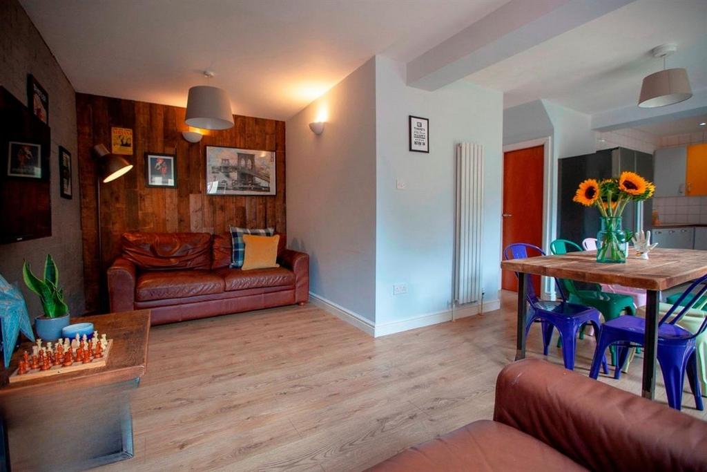 Bright lounge with dining area and wooden floor...