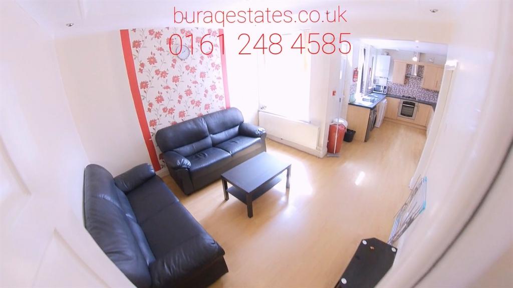 Bright living room with sofa seating and open p...