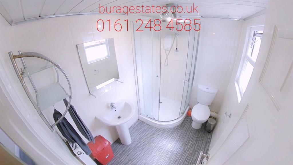 Bright modern bathroom with corner shower...