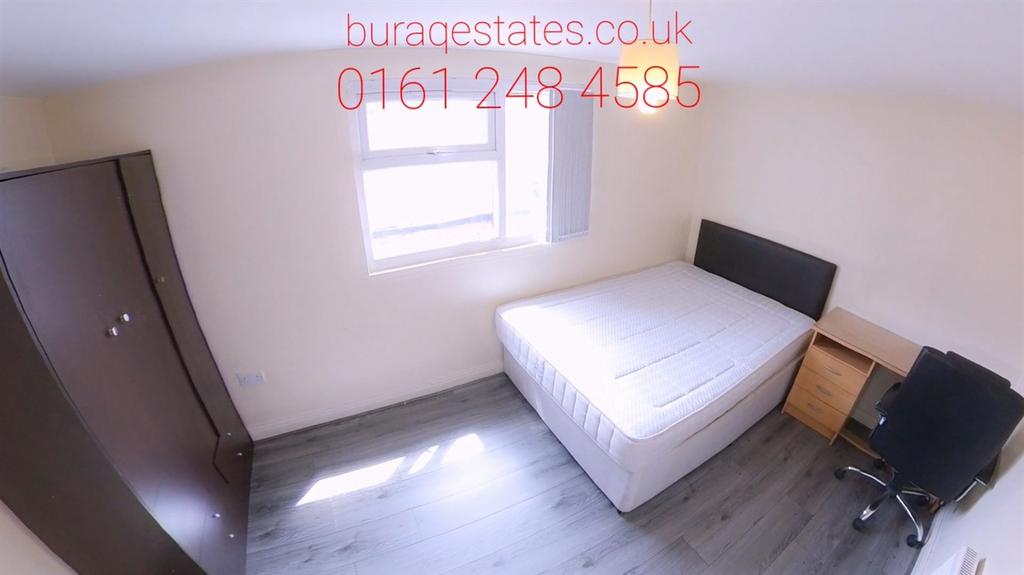 Bright, neatly furnished bedroom with storage...