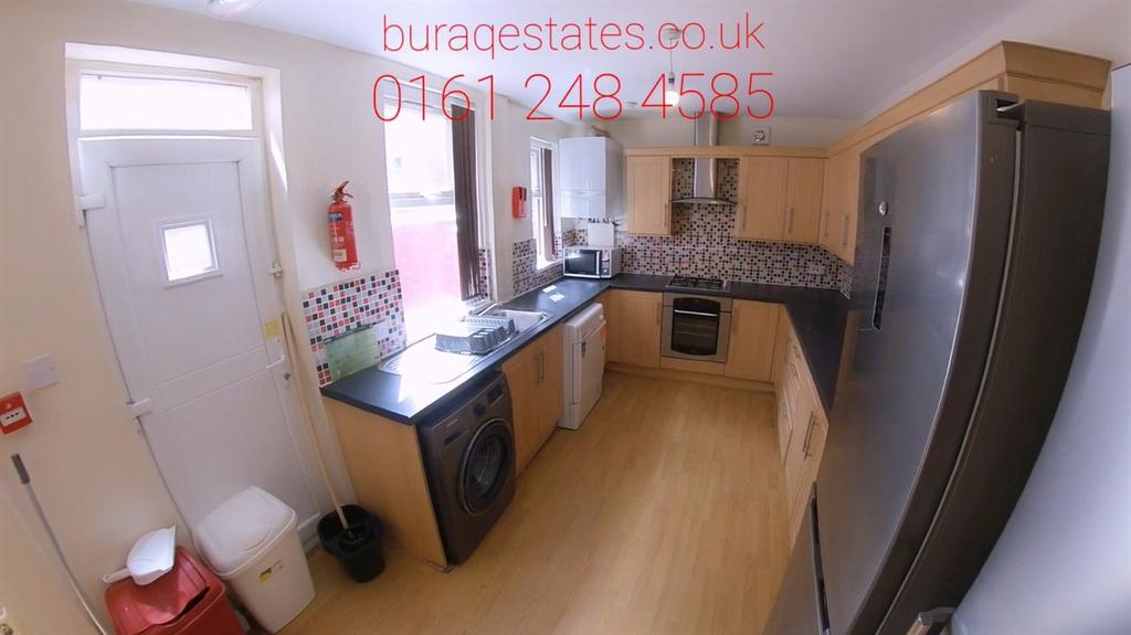 Bright modern galley kitchen with appliances...