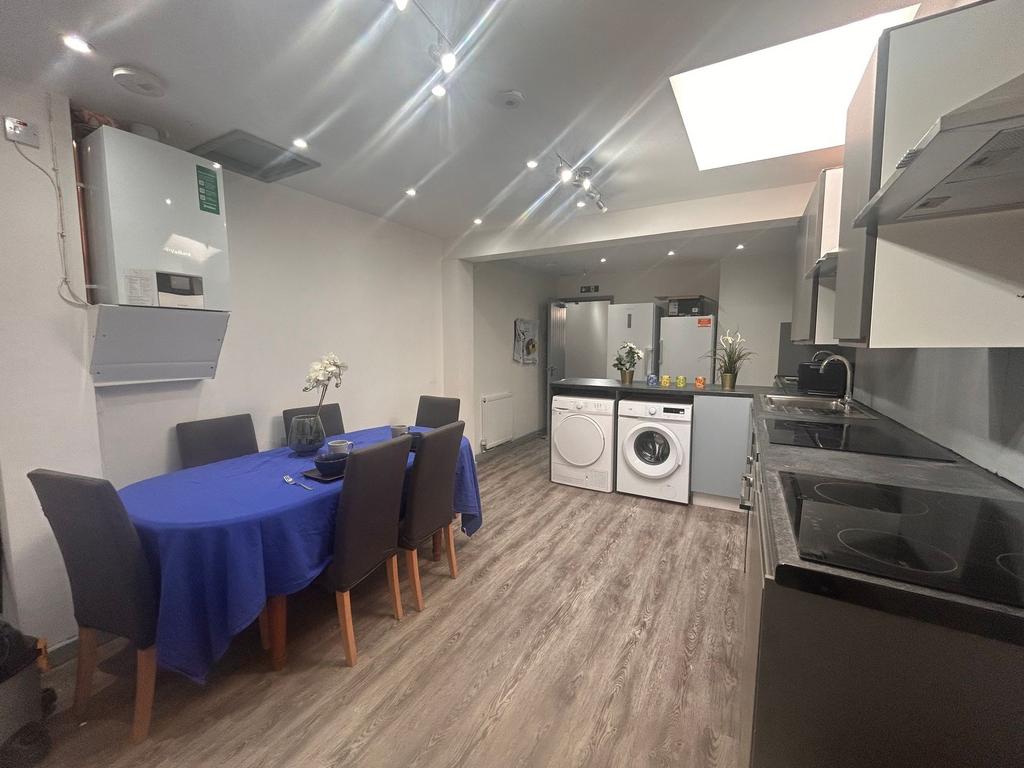 Spacious modern kitchen-diner with dining table...