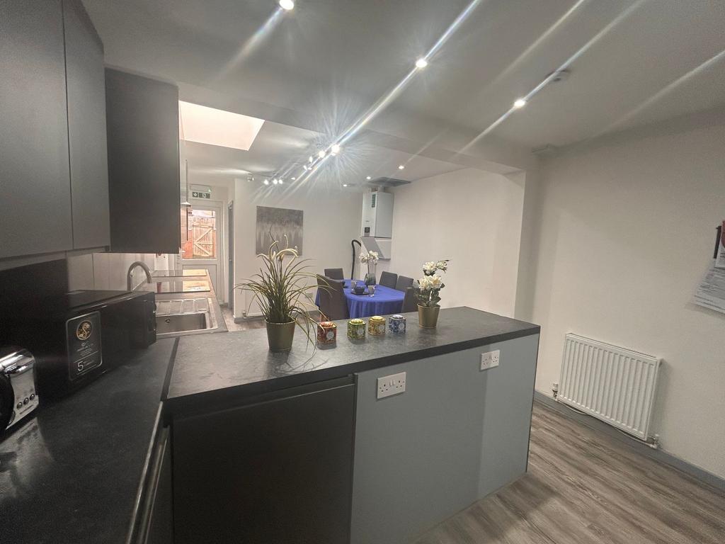 Modern open-plan kitchen with dining area...