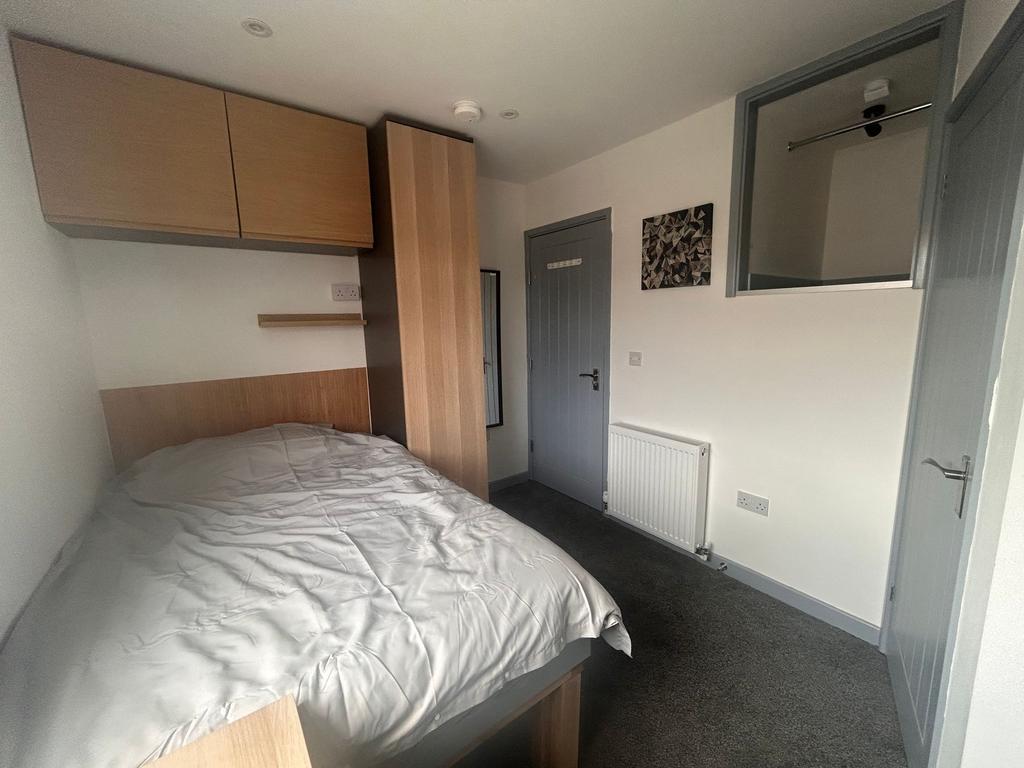 Neat single bedroom with built-in storage...