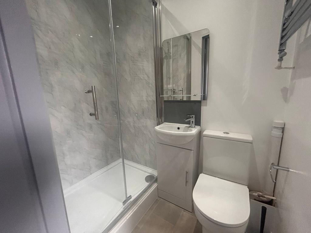 Modern bathroom with shower and basin...