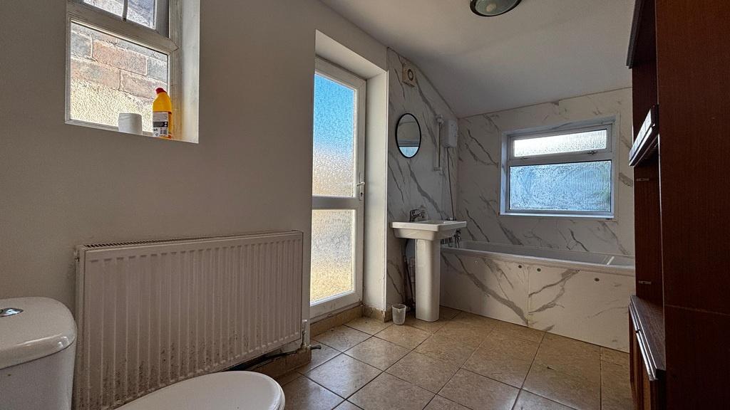 Bright bathroom with bath and vanity...