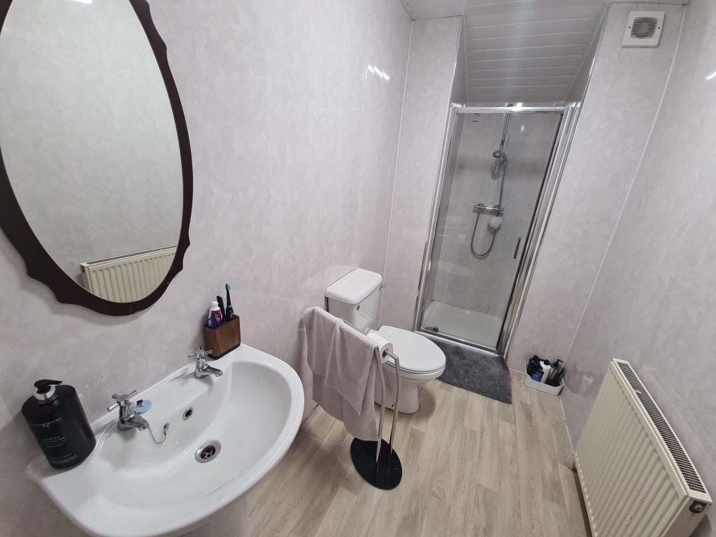 Bright bathroom with shower and modern fittings...
