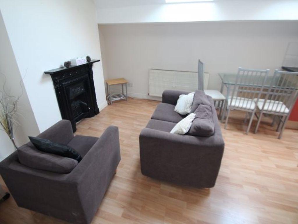 Bright living area with seating and dining spac...