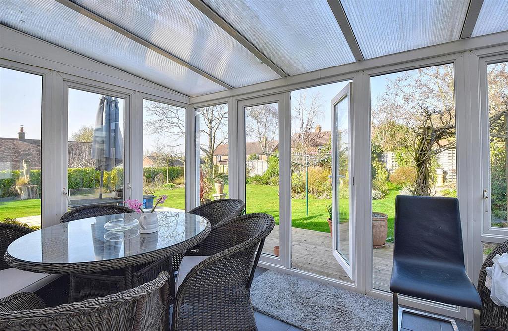 Conservatory interior, conservatory, french doors leading to garden