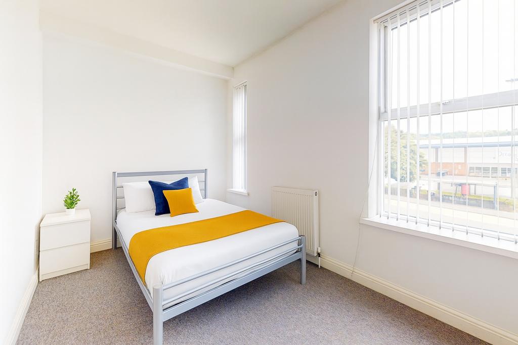 Bright, neatly presented bedroom with a double ...