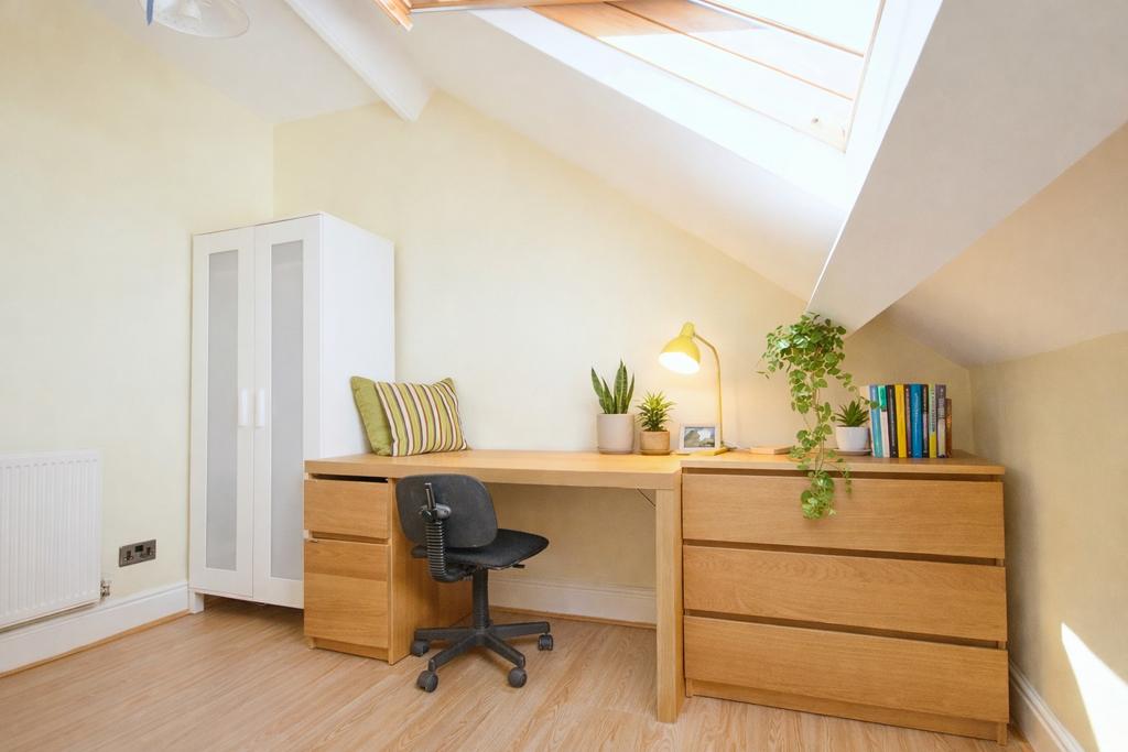 Bright, neatly arranged converted loft workspac...