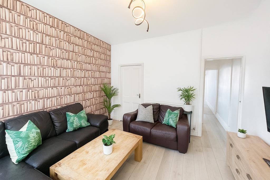 A modern and inviting living room featuring com...