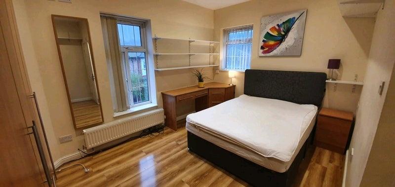 Bright furnished double bedroom with desk and b...