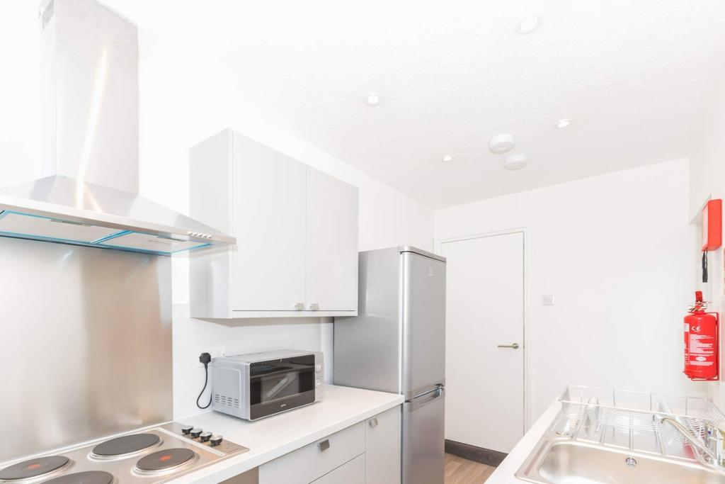 Bright modern kitchen with stainless appliances...