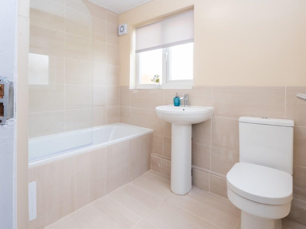 Bright modern bathroom with bath and WC...