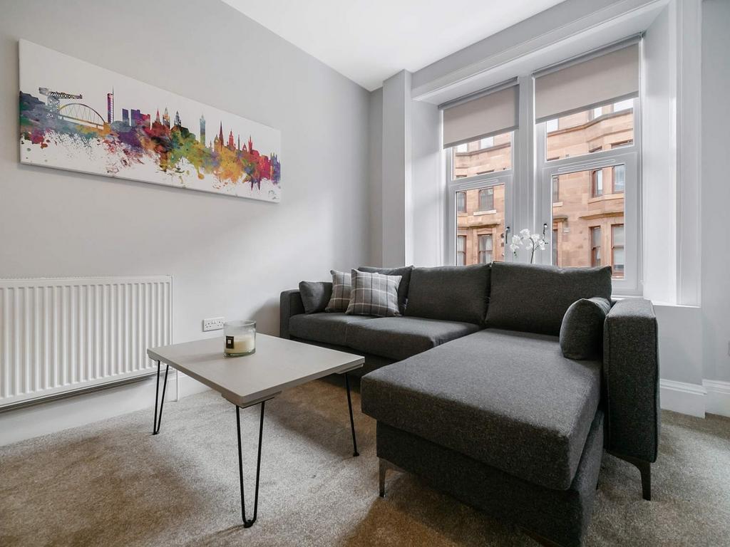 Bright modern living room with comfy sofa...