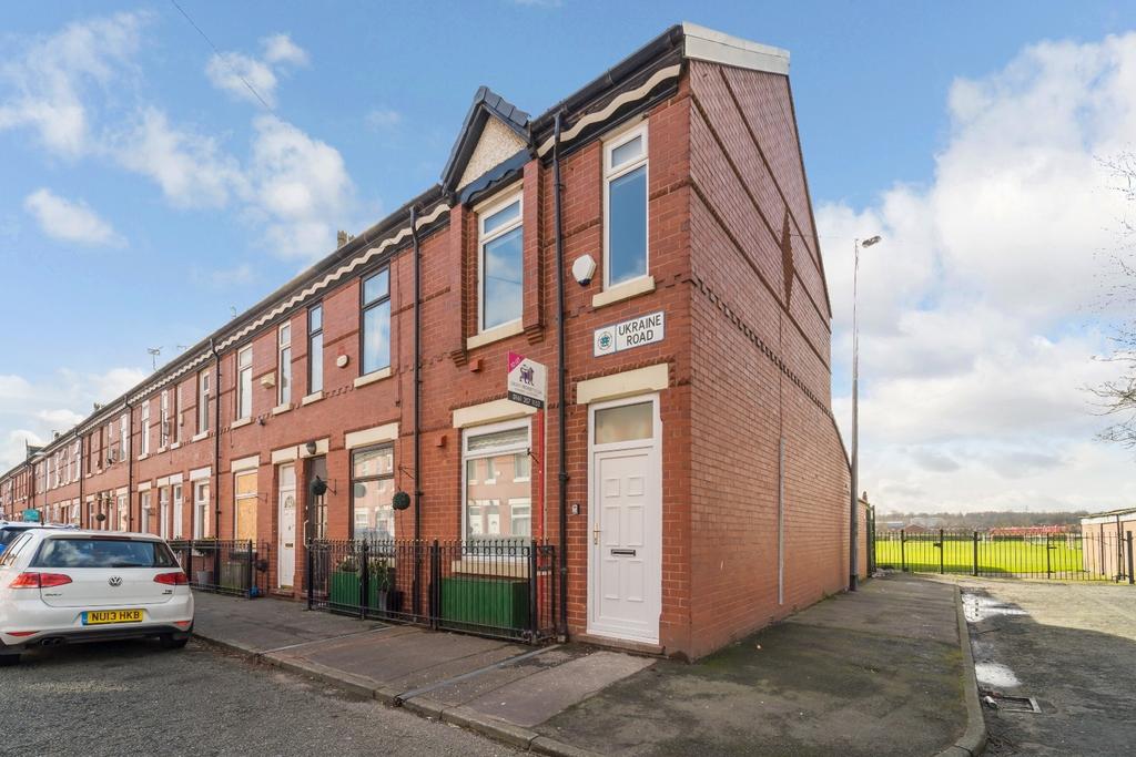 Corner terraced house with bright exterior and ...