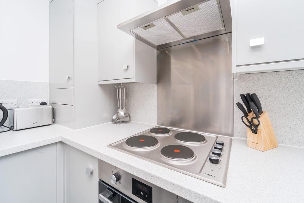 Bright, modern kitchen with sleek surfaces...
