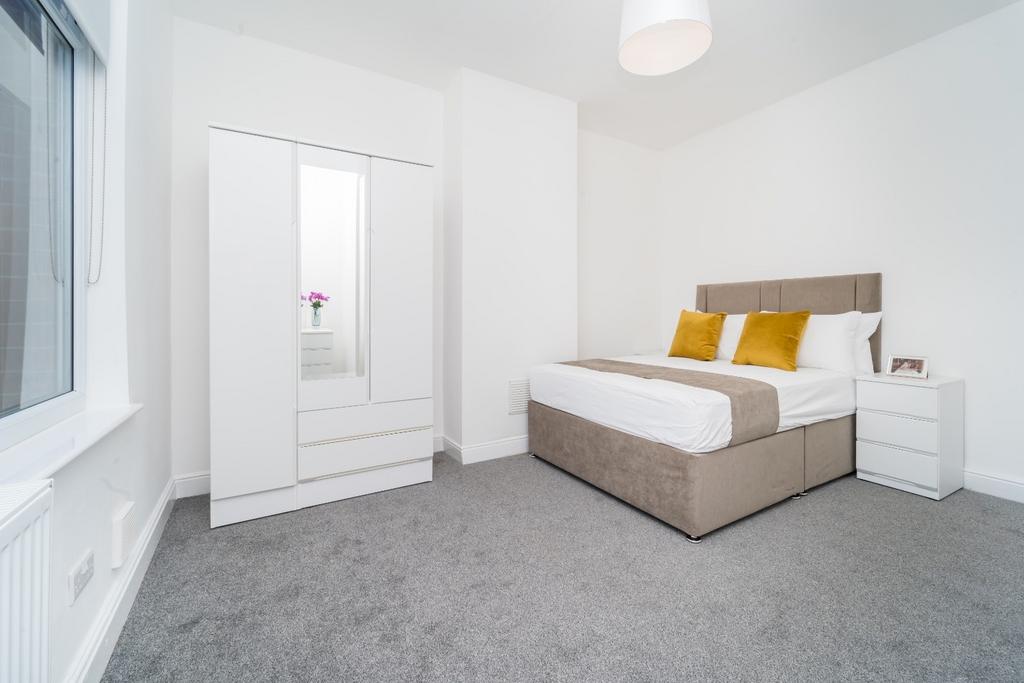 Bright double bedroom with modern neutral decor...