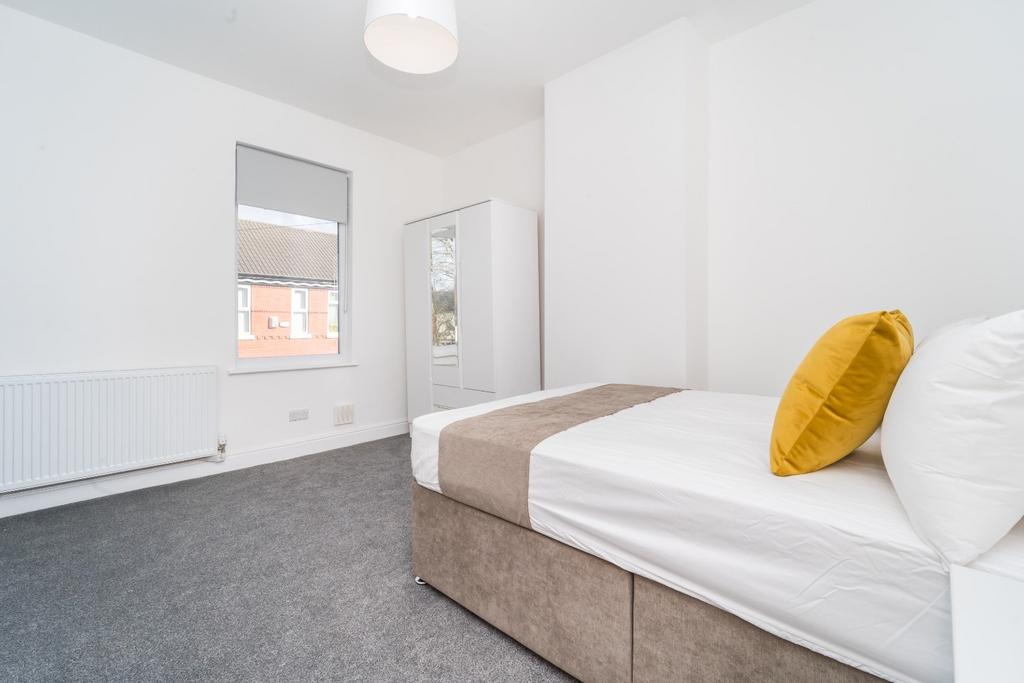 Bright, neat bedroom with built-in storage...