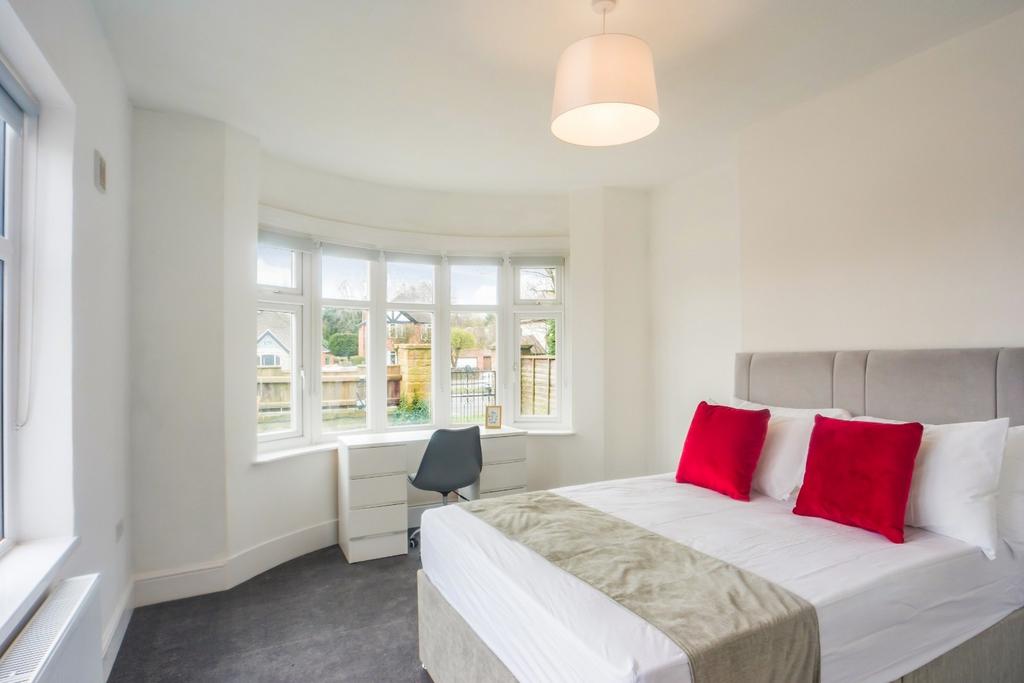Bright double bedroom with bay window...
