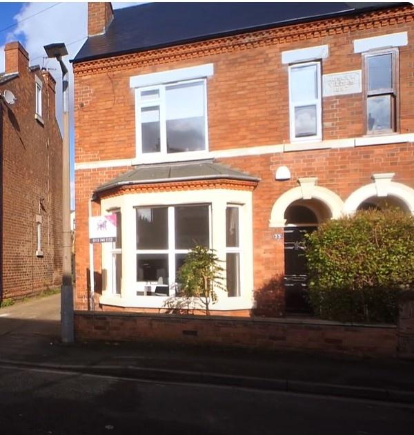 Attractive red‑brick house with bay window and ...
