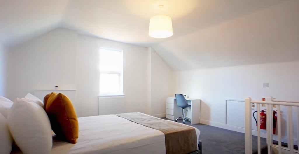 Bright airy bedroom with double bed and crib...