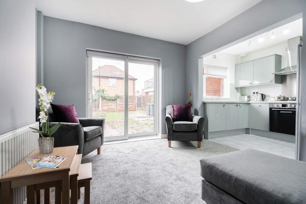 Bright open-plan lounge with garden access...