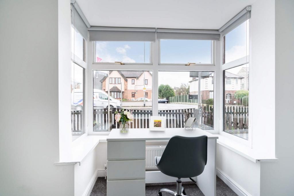 Bright bay-window study nook with street views...