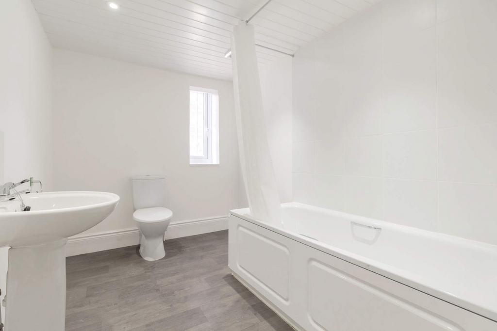Bright modern bathroom with white fittings...