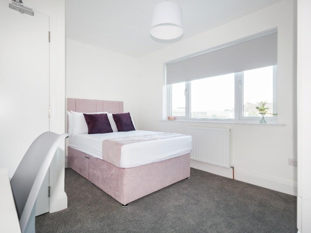 Bright bedroom with comfy double bed and desk...