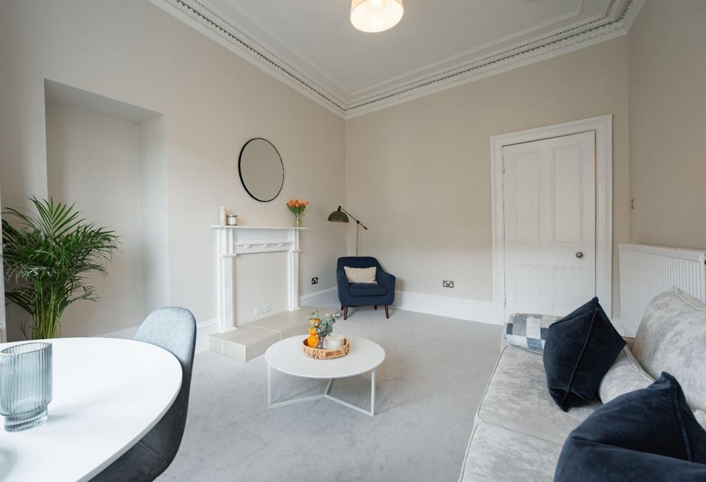 Bright modern living room with stylish seating...