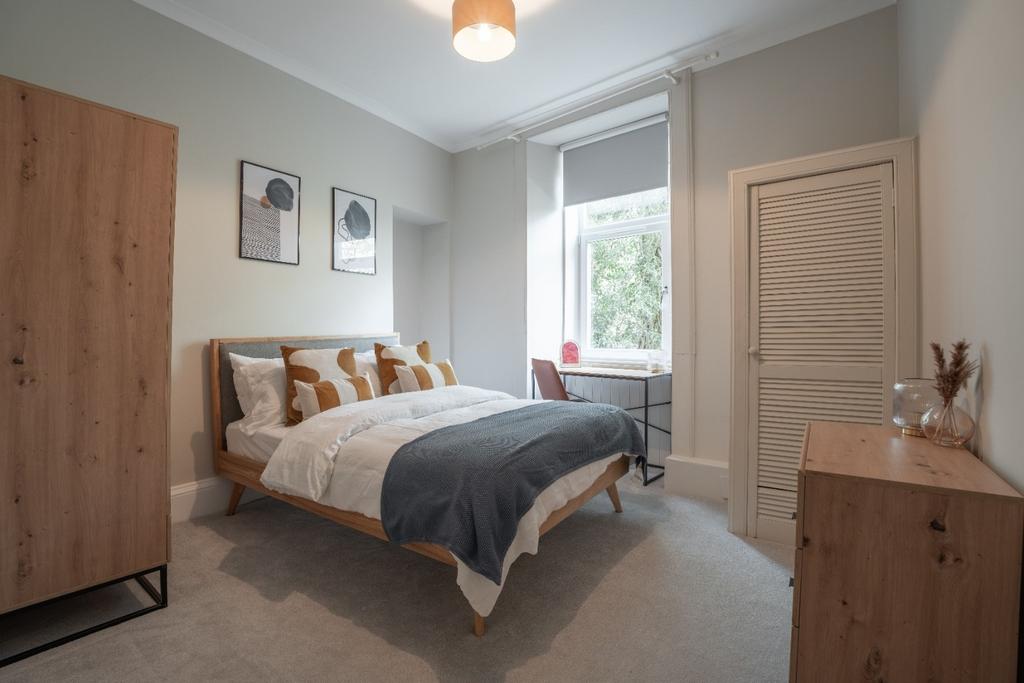 Bright, neatly staged double bedroom with study...