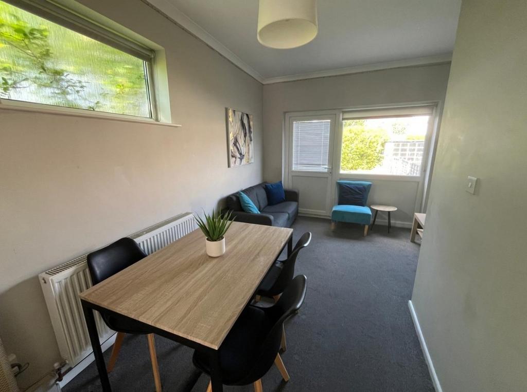 Bright living/dining area with natural light...