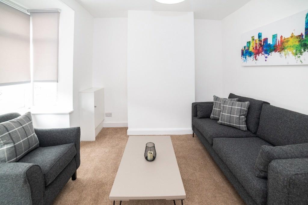 Bright, modern lounge with comfy sofas...