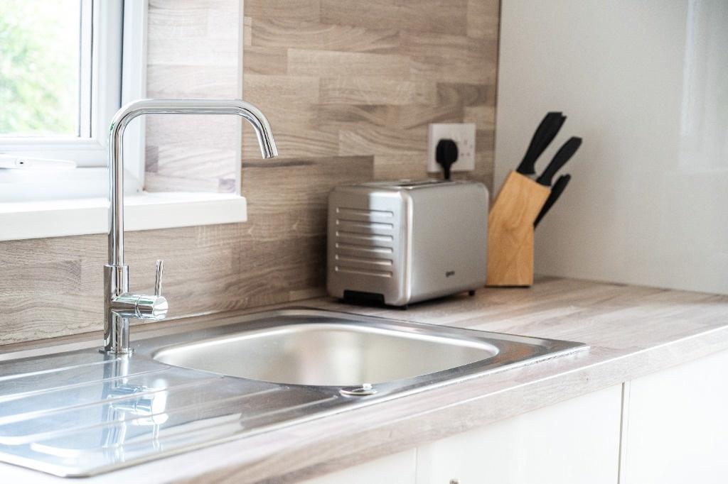 Clean modern kitchen sink with natural light...