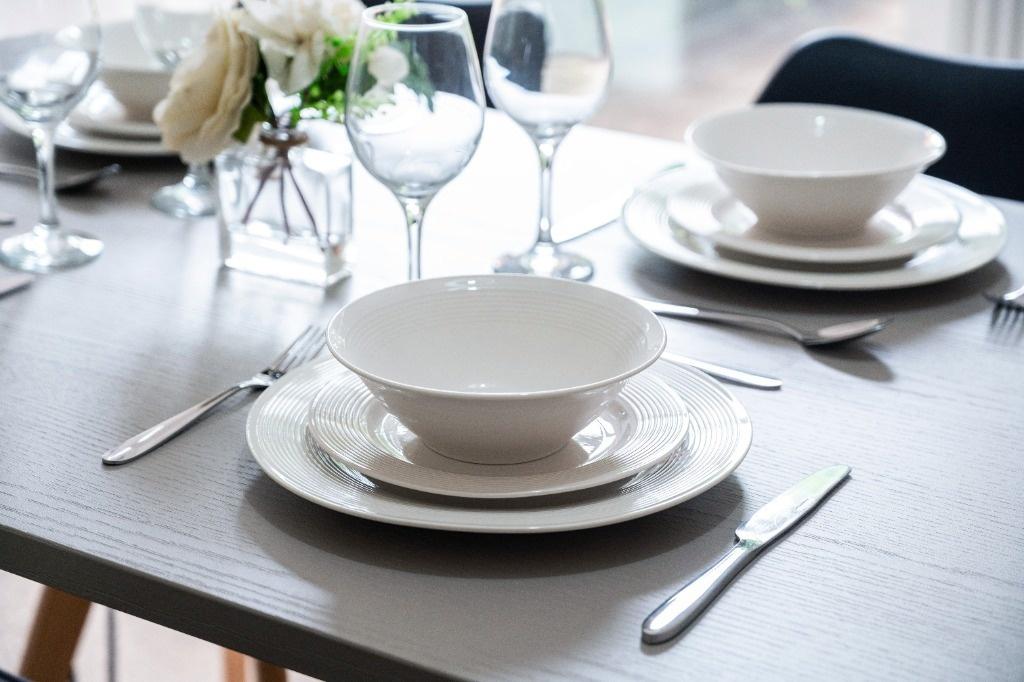Stylish place setting on a modern dining table...